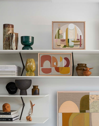 Adonis abstract wall art print small in oak frame, paired with Aphrodite print on shelving with terracotta arch backdrop