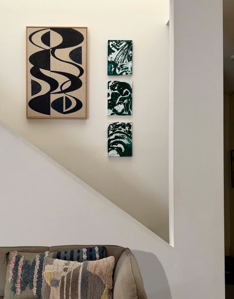 Green Marble Impasto paintings by Tory Burke hung in a styled interior
