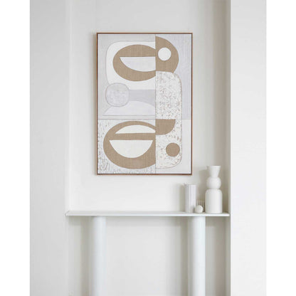A framed Giclee print featuring geometric balanced design with earthy and neutral colors, displayed on a white wall above a white console table.