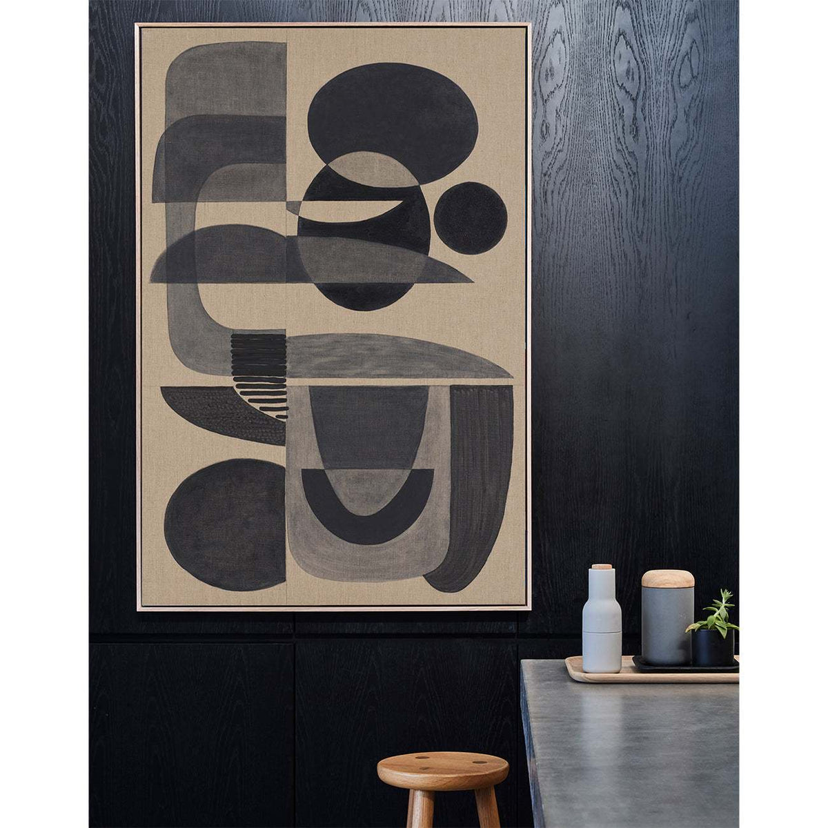 Charcoal Stucco - abstract wall art framed in raw oak on a black wall