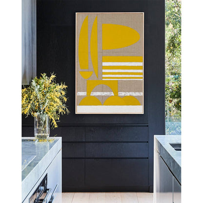 Yellow Stucco - Giclee print artwork framed in raw oak on a black kitchen wall