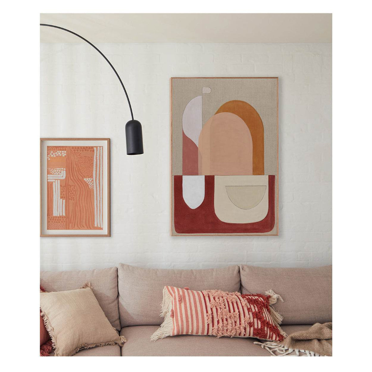 Large red abstract wall art above sofa in modern living room