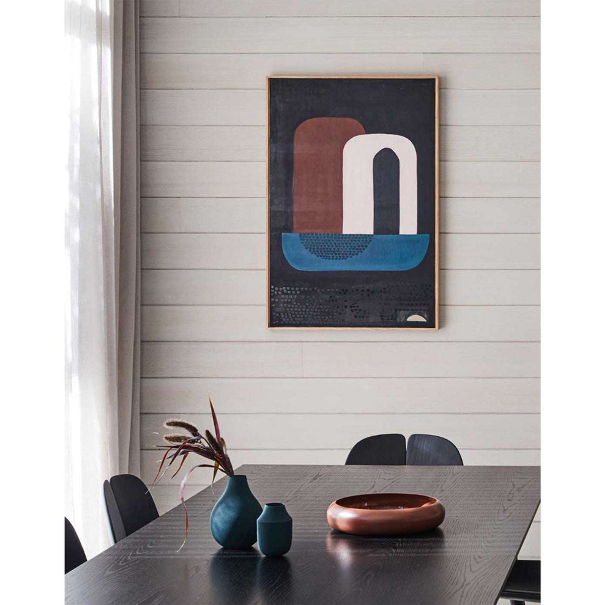 Large dark abstract wall art above sofa in modern interior