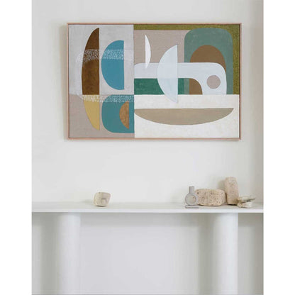 A framed Giclee print featuring geometric shapes in a palette of light blue, light green, bluish grey, and warm yellow, displayed on a white wall above a white counter.