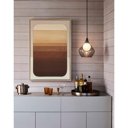 Modern kitchen with a bar setup, including bottles and glasses, against a wooden wall with a framed abstract painting.