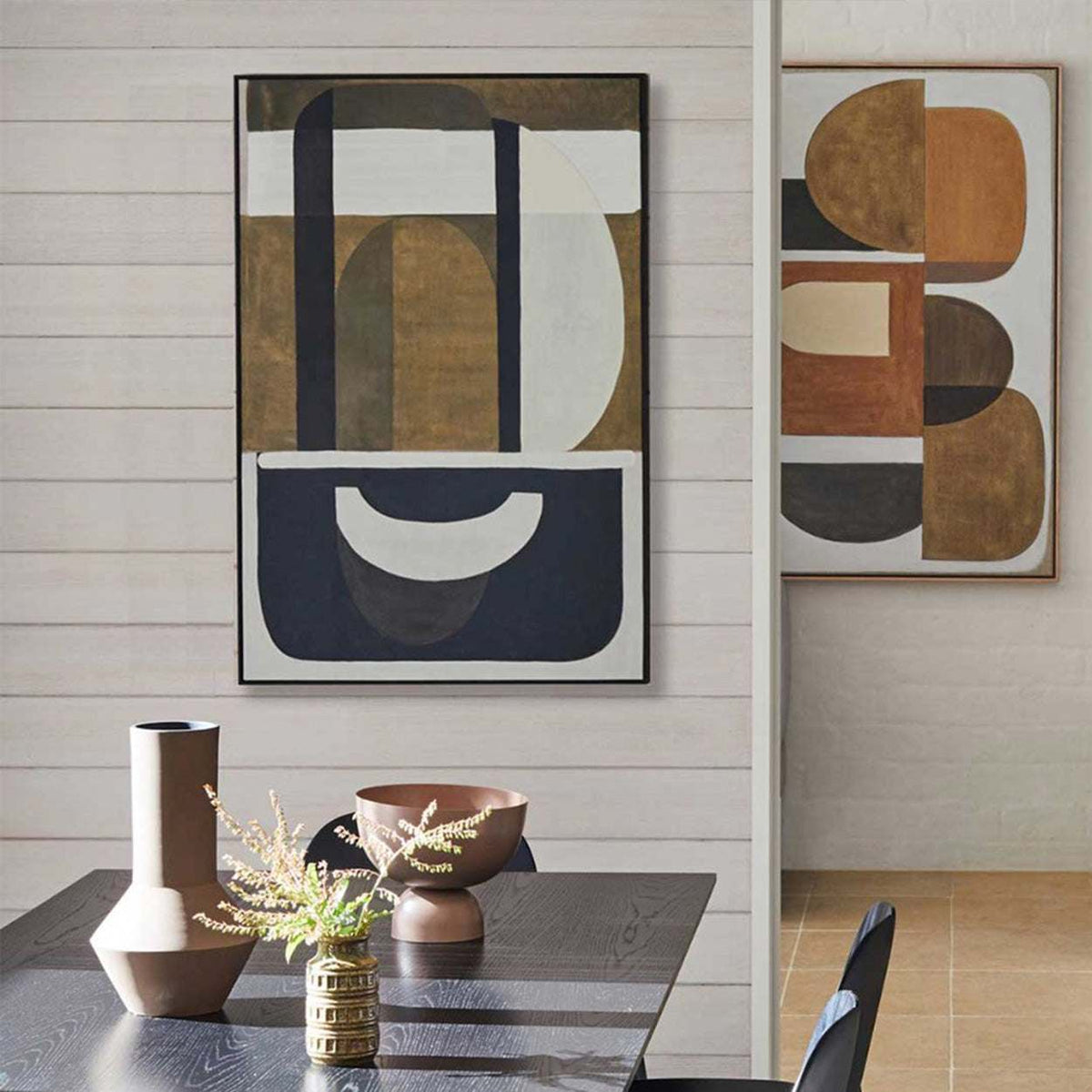 Large abstract wall art above sofa in modern living room with neutral palette