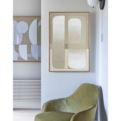 Modern interior with a green chair and abstract wall art in a minimalistic setting