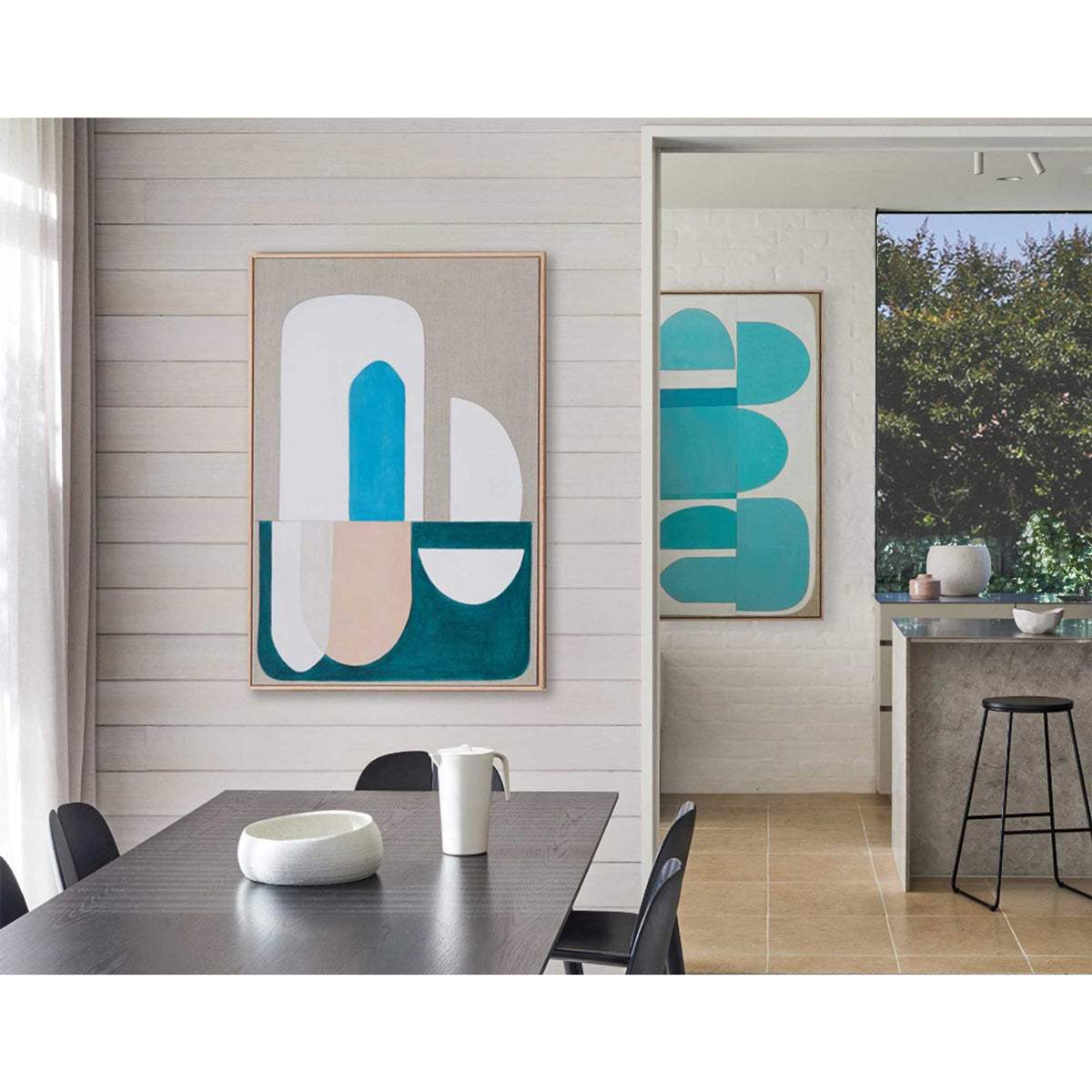 Large blue abstract wall art above sofa in modern living room